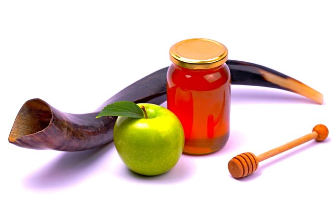 Apple and honey - a snack eaten by jews on Rosh Hashana..Shofar - A horn used in the jewish holidays of Rosh Hashana and Yom Kippur.